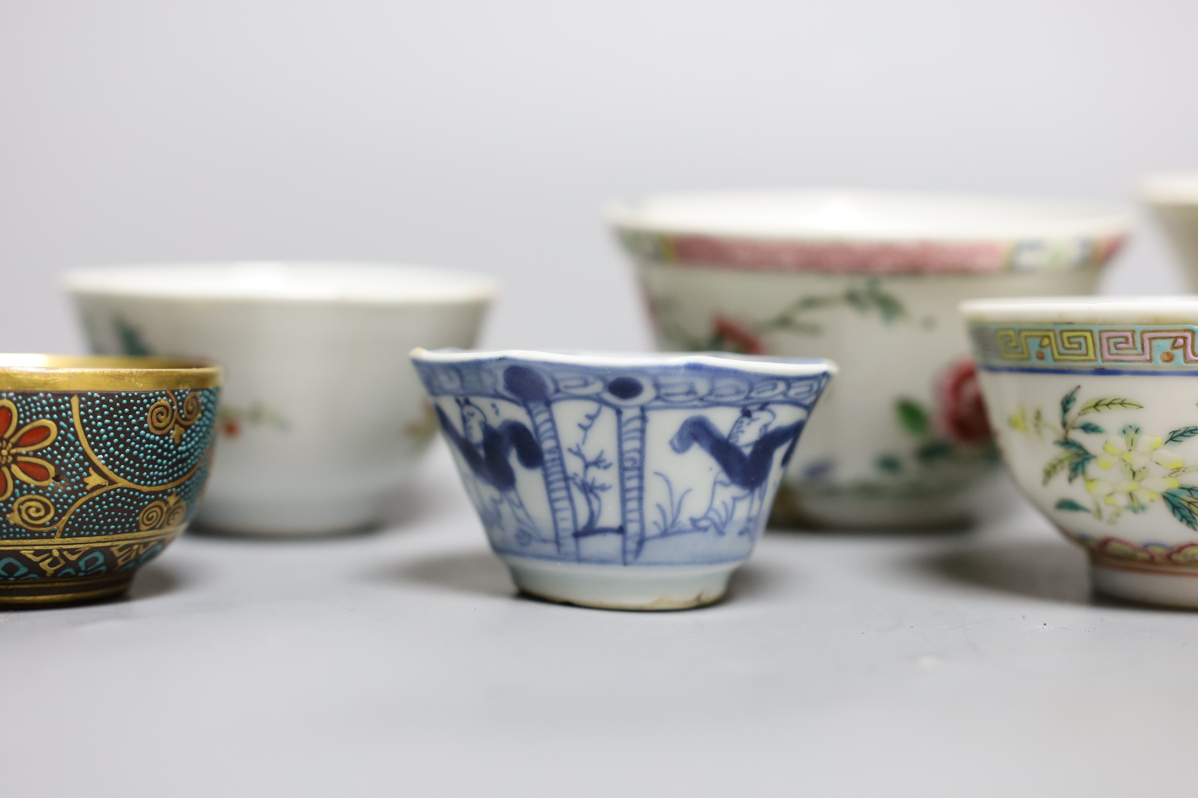A Chinese Dehua libation cup, eight 18th century and later Chinese porcelain tea bowls and a Kutani tea bowl